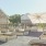 Garden boxes in gravel with large umbrella above