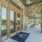 Large wood doors with blue mat in front