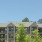 Apartment building exterior with view of rooftops