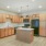 Kitchen with island and orange cabinets