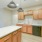 Kitchen with island and orange cabinets